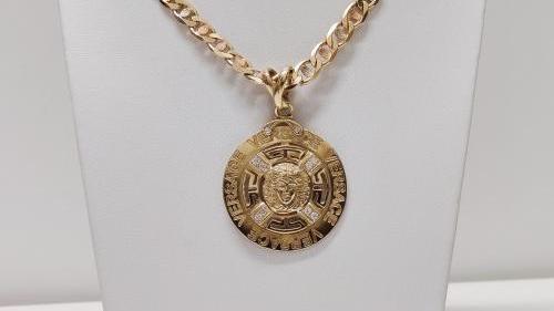 Importante collana con ciondolo Versace.